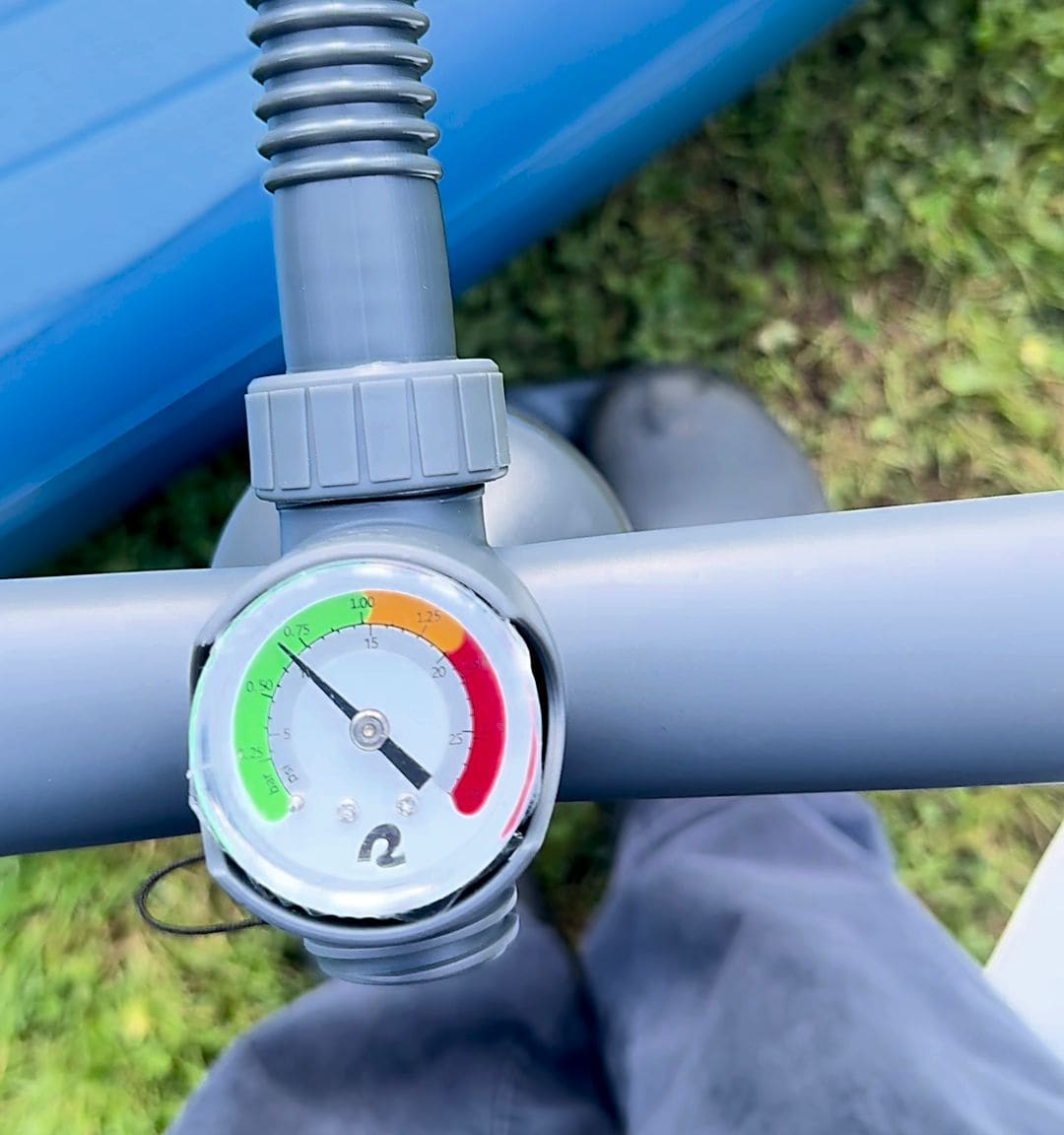 Pump gauge needle climbing through the green zone toward the yellow zone during inflation